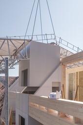 Prefabricated modules are brought to the construction site